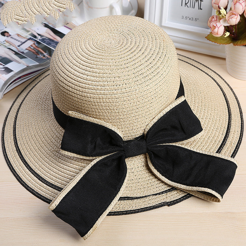 Riviera Radiance: The Wide-Brimmed Striped Straw Hat