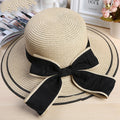 Riviera Radiance: The Wide-Brimmed Striped Straw Hat