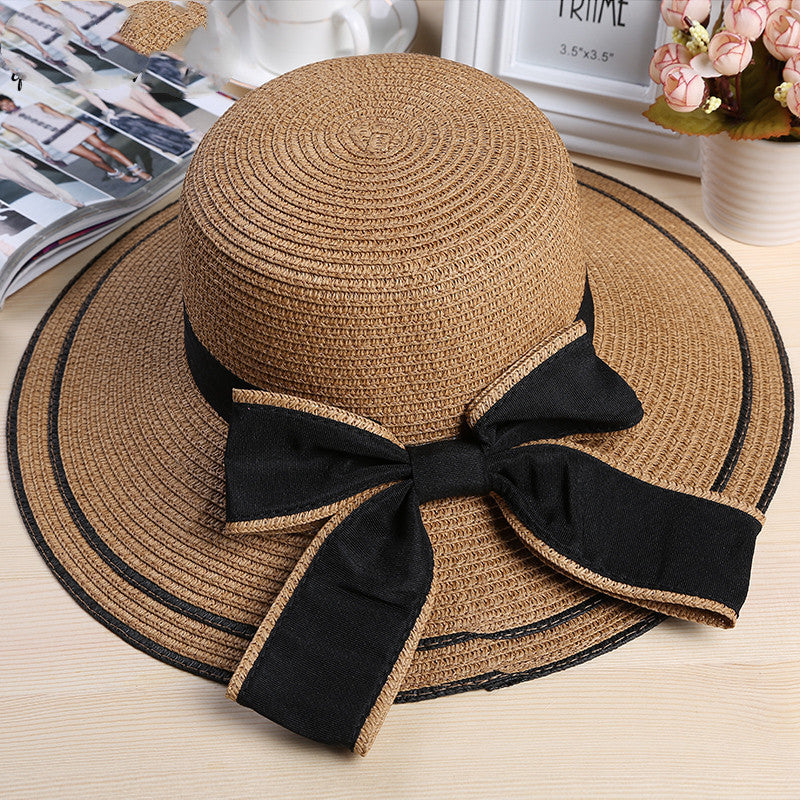Riviera Radiance: The Wide-Brimmed Striped Straw Hat