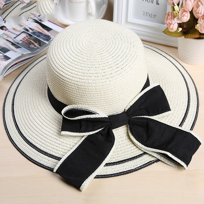 Riviera Radiance: The Wide-Brimmed Striped Straw Hat