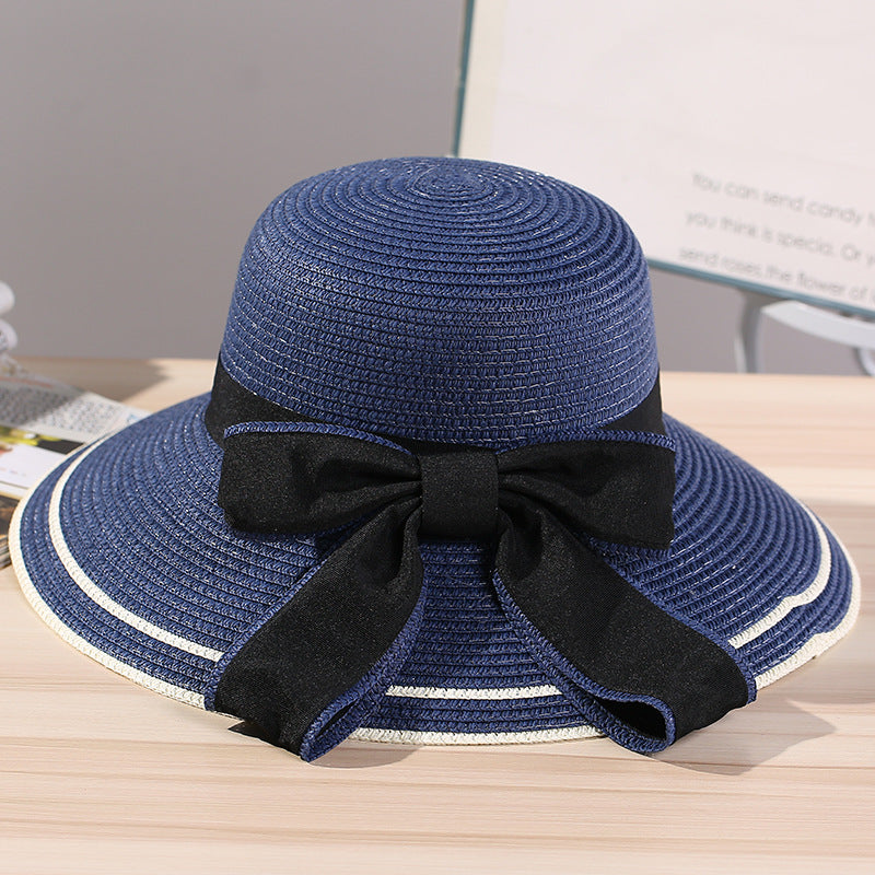 Riviera Radiance: The Wide-Brimmed Striped Straw Hat