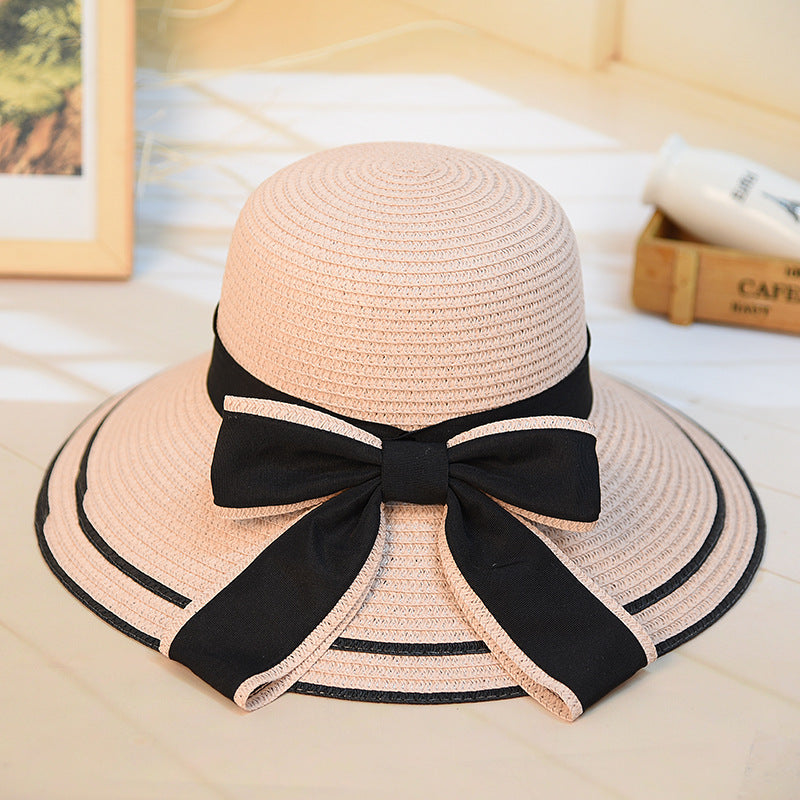 Riviera Radiance: The Wide-Brimmed Striped Straw Hat